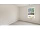 Serene bedroom with soft carpet and natural light streaming through the window at 42 Sweet Meadow Rd, Angier, NC 27501