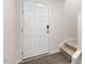 Entryway with light walls, plank flooring, leading to stairs with neutral carpet at 42 Sweet Meadow Rd, Angier, NC 27501