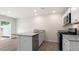 Open kitchen design with stainless appliances, granite countertops, and modern finishes at 42 Sweet Meadow Rd, Angier, NC 27501