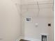 Unfinished laundry room includes utility connections and ample space for customization at 42 Sweet Meadow Rd, Angier, NC 27501