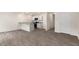 Open floor plan showing kitchen with island and living area with luxury vinyl plank flooring at 42 Sweet Meadow Rd, Angier, NC 27501