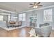 Spacious dining room featuring hardwood floors, a ceiling fan, and ample seating at 442 Steel Hopper Way, Garner, NC 27529