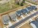 Aerial shot showcasing a well-planned neighborhood with modern homes, manicured lawns, and tree-lined streets at 4513 Bridle Run Dr, Raleigh, NC 27606