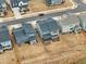 Aerial shot of modern gray homes with fenced backyards, neatly lined along a residential street in a planned community at 4513 Bridle Run Dr, Raleigh, NC 27606