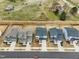 An aerial view of modern homes with manicured lawns, showcasing neighborhood charm and curb appeal at 4513 Bridle Run Dr, Raleigh, NC 27606