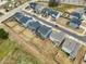 Aerial shot of a residential neighborhood with modern gray homes, fenced yards, and a neatly planned layout at 4513 Bridle Run Dr, Raleigh, NC 27606