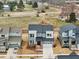 Aerial view of a neighborhood displaying modern two-story homes with manicured lawns and tree-lined streets at 4513 Bridle Run Dr, Raleigh, NC 27606