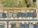 Aerial view showcasing modern homes in a neatly planned community with fenced yards and paved streets at 4513 Bridle Run Dr, Raleigh, NC 27606