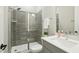 Modern bathroom featuring a glass-enclosed shower with gray tile and a white vanity at 4513 Bridle Run Dr, Raleigh, NC 27606