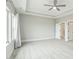 Bedroom showcasing a ceiling fan, carpet, ensuite bathroom, and natural light at 4513 Bridle Run Dr, Raleigh, NC 27606
