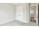Neutral bedroom featuring carpet and white doors at 4513 Bridle Run Dr, Raleigh, NC 27606