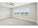 Bright bedroom with carpet, fan, and great natural light at 4513 Bridle Run Dr, Raleigh, NC 27606
