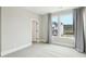 This neutral bedroom features carpet, two windows and white trim at 4513 Bridle Run Dr, Raleigh, NC 27606