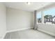 Neutral bedroom featuring carpet, two windows and white trim at 4513 Bridle Run Dr, Raleigh, NC 27606