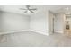 Large bedroom with carpet, ceiling fan, and walk in closet at 4513 Bridle Run Dr, Raleigh, NC 27606