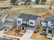 Gray two-story home with brick entryway, front-facing garage, and a well-manicured yard in a suburban setting at 4513 Bridle Run Dr, Raleigh, NC 27606
