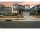 Modern home featuring brick accents, a two-car garage, and a sleek, contemporary design at 4513 Bridle Run Dr, Raleigh, NC 27606