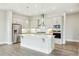 Modern kitchen featuring stainless steel appliances, a large island, and recessed lighting at 4513 Bridle Run Dr, Raleigh, NC 27606