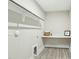 Laundry room featuring tile floors, built in counter space, and washer dryer hookups at 4513 Bridle Run Dr, Raleigh, NC 27606