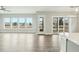 Bright living room featuring hardwood floors, a ceiling fan, and lots of natural light at 4513 Bridle Run Dr, Raleigh, NC 27606