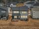 Two story home with neutral siding, multiple windows and a screened porch at 4513 Bridle Run Dr, Raleigh, NC 27606