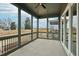 Spacious screened-in porch with views of the backyard and surrounding landscape at 4513 Bridle Run Dr, Raleigh, NC 27606