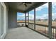 Large screened-in porch with ceiling fan and peaceful outdoor views at 4513 Bridle Run Dr, Raleigh, NC 27606