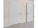 Hallway showing the two closed doors and neutral carpet at 46 Sweet Meadow Rd, Angier, NC 27501