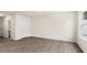 Large living room with hardwood flooring is filled with natural light and neutral walls at 46 Sweet Meadow Rd, Angier, NC 27501