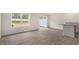 Open-concept living room boasts durable flooring and access to the backyard patio at 46 Sweet Meadow Rd, Angier, NC 27501