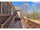 Expansive wooden deck with access to a screened-in porch, providing ample outdoor living space and backyard views at 484 Galaxy Dr, Garner, NC 27529