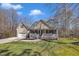 Charming home featuring a welcoming front porch, attached garage, and well-maintained lawn at 484 Galaxy Dr, Garner, NC 27529