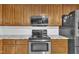Kitchen features stainless steel appliances, granite countertops, and wood cabinets, providing a modern cooking experience at 484 Galaxy Dr, Garner, NC 27529