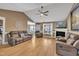 Spacious living room featuring a fireplace and ceiling fan at 484 Galaxy Dr, Garner, NC 27529