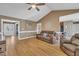 Open living room with wood-look floors, neutral walls, and vaulted ceiling, creating a bright and inviting space at 484 Galaxy Dr, Garner, NC 27529