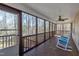Inviting screened porch with rocking chairs, offering a relaxing outdoor space with views of the backyard at 484 Galaxy Dr, Garner, NC 27529