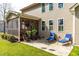Outdoor patio featuring comfortable seating with a view of the backyard and screened in porch at 50 Lockamy Ln, Youngsville, NC 27596