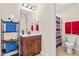Well-lit bathroom featuring tile floors, modern vanity, mirror, and shower with curtain at 50 Lockamy Ln, Youngsville, NC 27596