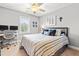 This bedroom features a ceiling fan, a closet, and carpeted floors at 50 Lockamy Ln, Youngsville, NC 27596