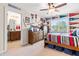 Sports themed bedroom with ceiling fan, and decorated with sports memorabilia in a cheerful setting at 50 Lockamy Ln, Youngsville, NC 27596