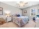 This bedroom features carpeted floors, a ceiling fan, and a closet at 50 Lockamy Ln, Youngsville, NC 27596