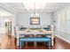 Charming dining room with a modern chandelier, stylish furnishings, and lots of natural light at 50 Lockamy Ln, Youngsville, NC 27596
