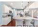 Modern kitchen featuring white cabinets, granite countertops, and stainless steel appliances and an island at 50 Lockamy Ln, Youngsville, NC 27596