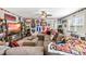 Spacious living room with sports decor, sectional sofa, tv, and natural light at 50 Lockamy Ln, Youngsville, NC 27596