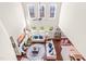 Sun-filled living room with vaulted ceilings, fireplace, and plenty of natural light from surrounding windows at 50 Lockamy Ln, Youngsville, NC 27596