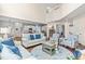Open-concept living room featuring hardwood floors, neutral furniture, and view into the kitchen at 50 Lockamy Ln, Youngsville, NC 27596