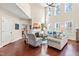Bright living room with fireplace, hardwood floors, lots of natural light, and a cozy ambiance at 50 Lockamy Ln, Youngsville, NC 27596