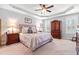 Serene main bedroom with tray ceilings and plush furnishings, perfect for relaxing at 50 Lockamy Ln, Youngsville, NC 27596