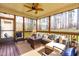 Relaxing screened-in porch with comfortable seating and view of treed backyard at 50 Lockamy Ln, Youngsville, NC 27596
