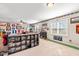 Spacious recreation room with sectional sofa, windows, sports decor, carpet, and entertainment at 50 Lockamy Ln, Youngsville, NC 27596